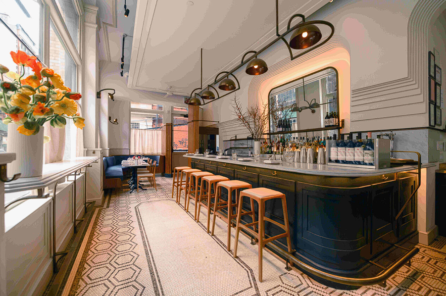 Modern bistro interior with geometric pendant lights and warm ambiance