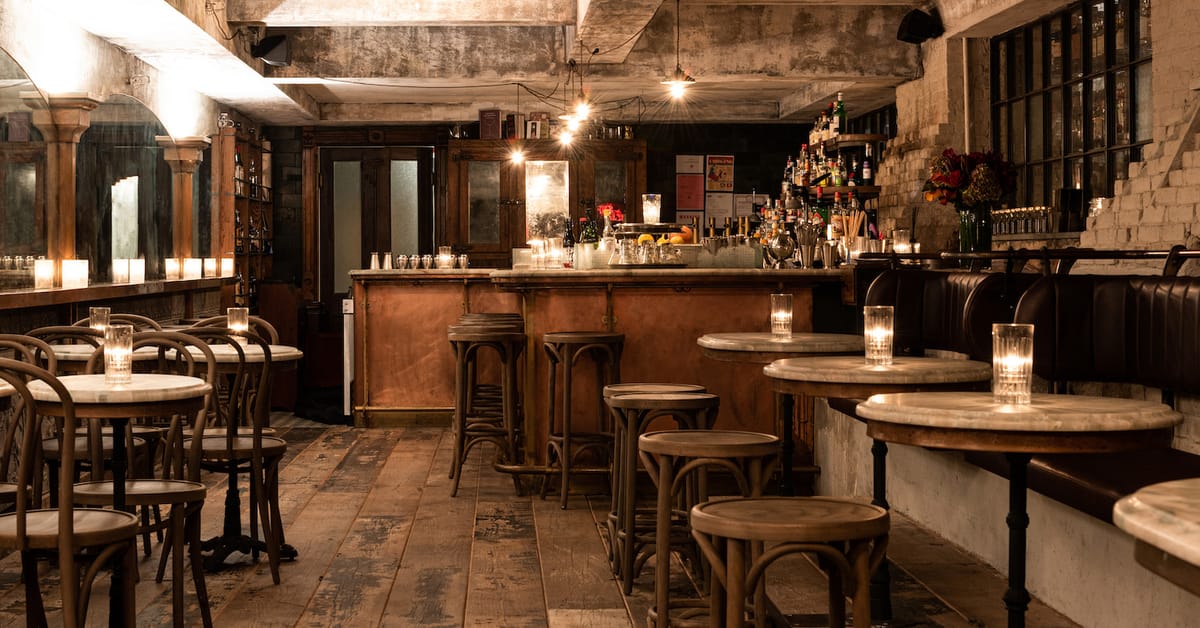 Modern bistro interior with geometric pendant lights and warm ambiance