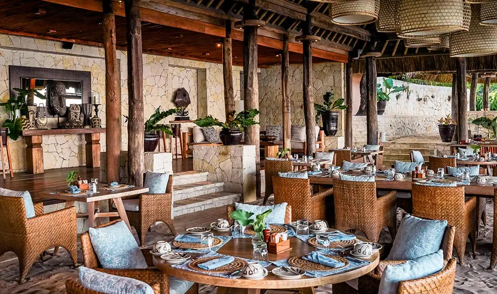 Modern bistro interior with geometric pendant lights and warm ambiance