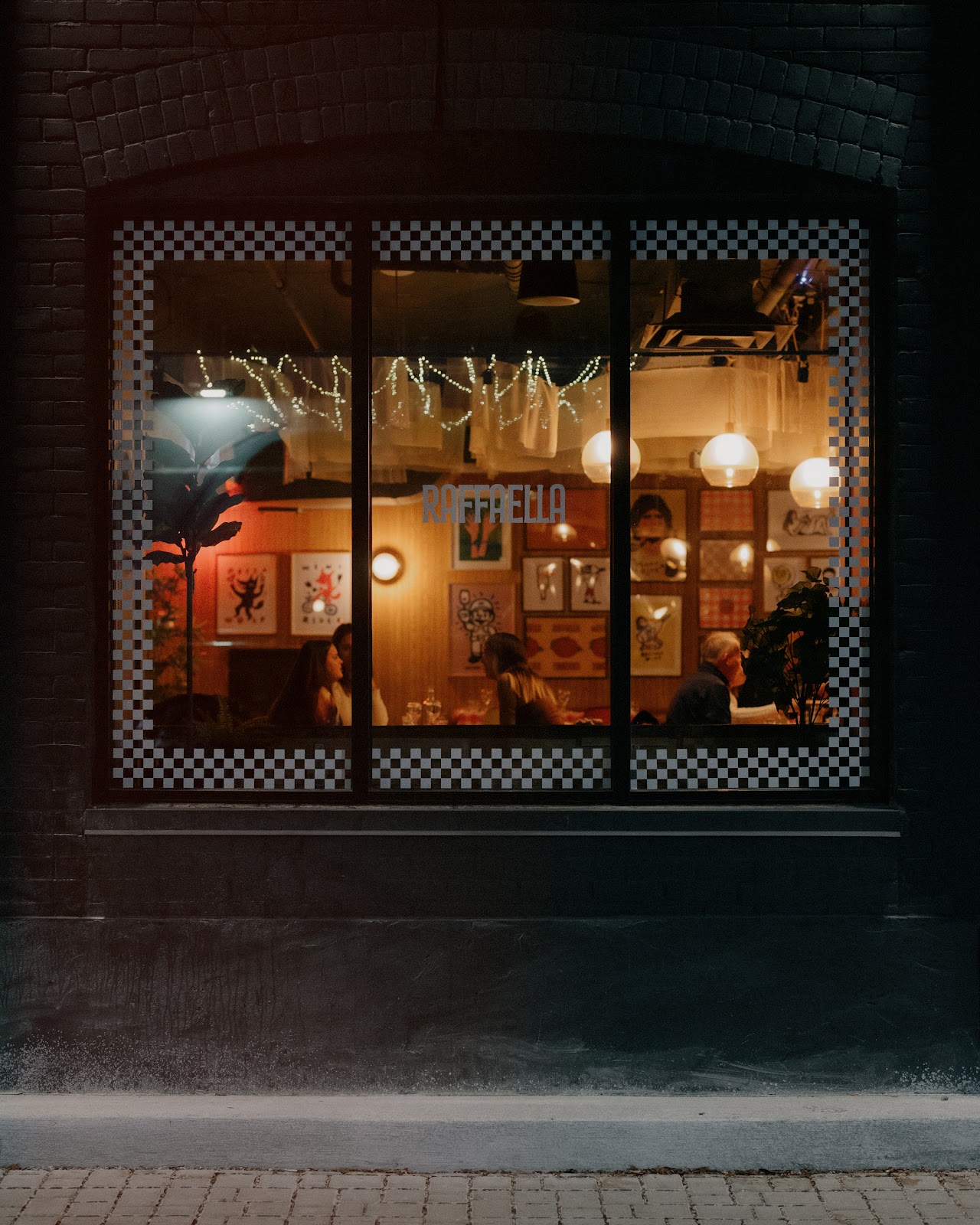 Modern bistro interior with geometric pendant lights and warm ambiance