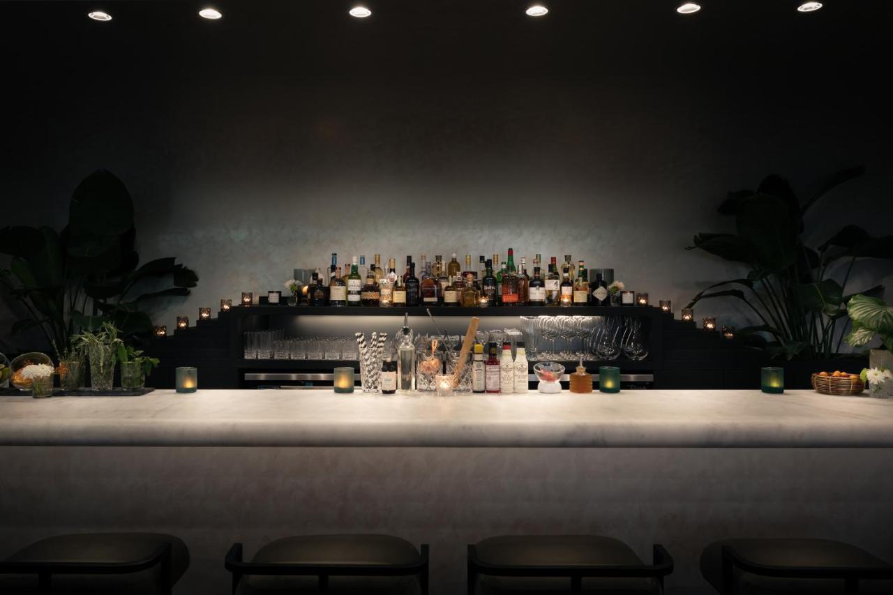 Modern bistro interior with geometric pendant lights and warm ambiance