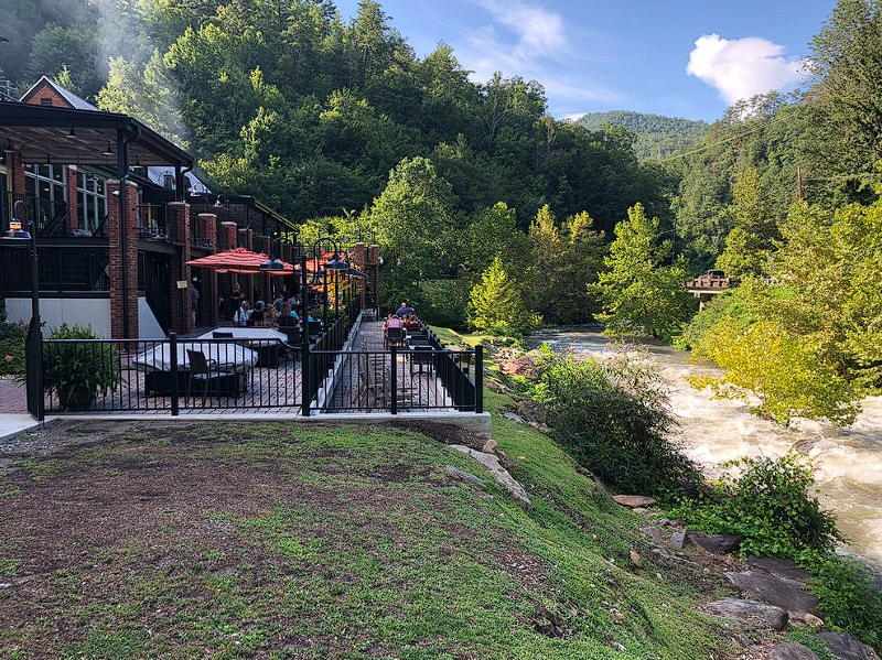 Modern bistro interior with geometric pendant lights and warm ambiance