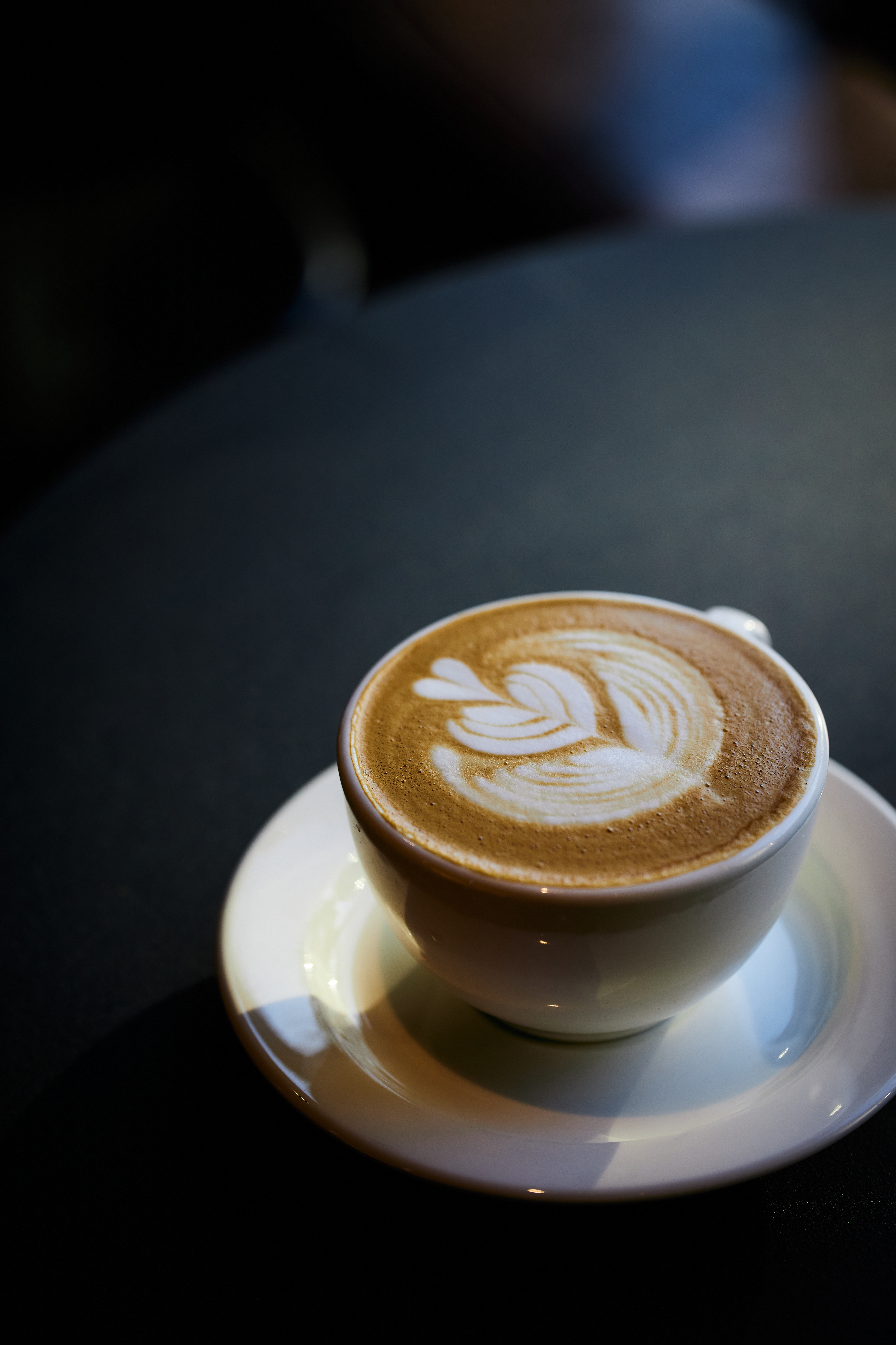 Modern bistro interior with geometric pendant lights and warm ambiance