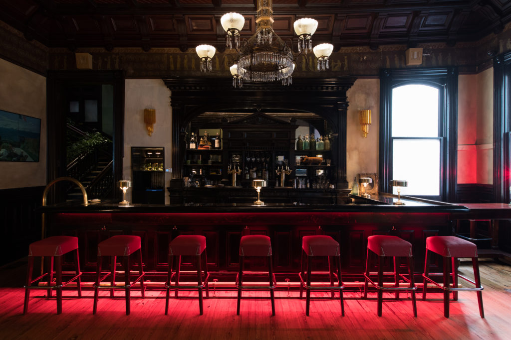 Modern bistro interior with geometric pendant lights and warm ambiance